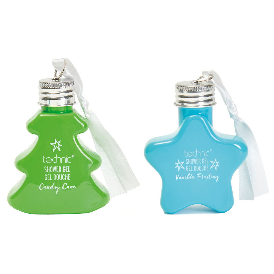 Paveikslėlyje dvi mini dušo želė Kalėdoms. Kairėje - žalia, eglutės formos ir kalėdinio saldainio kvapo. Dešinėje - mėlyna, žvaigždutės formos, vanilės kvapo. Dušo gelis po 50ml pakuotėje. Vegan. Netestuota su gyvūnais